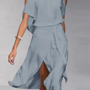 Madonna - Robe élégante avec découpes aux épaules à la mode.